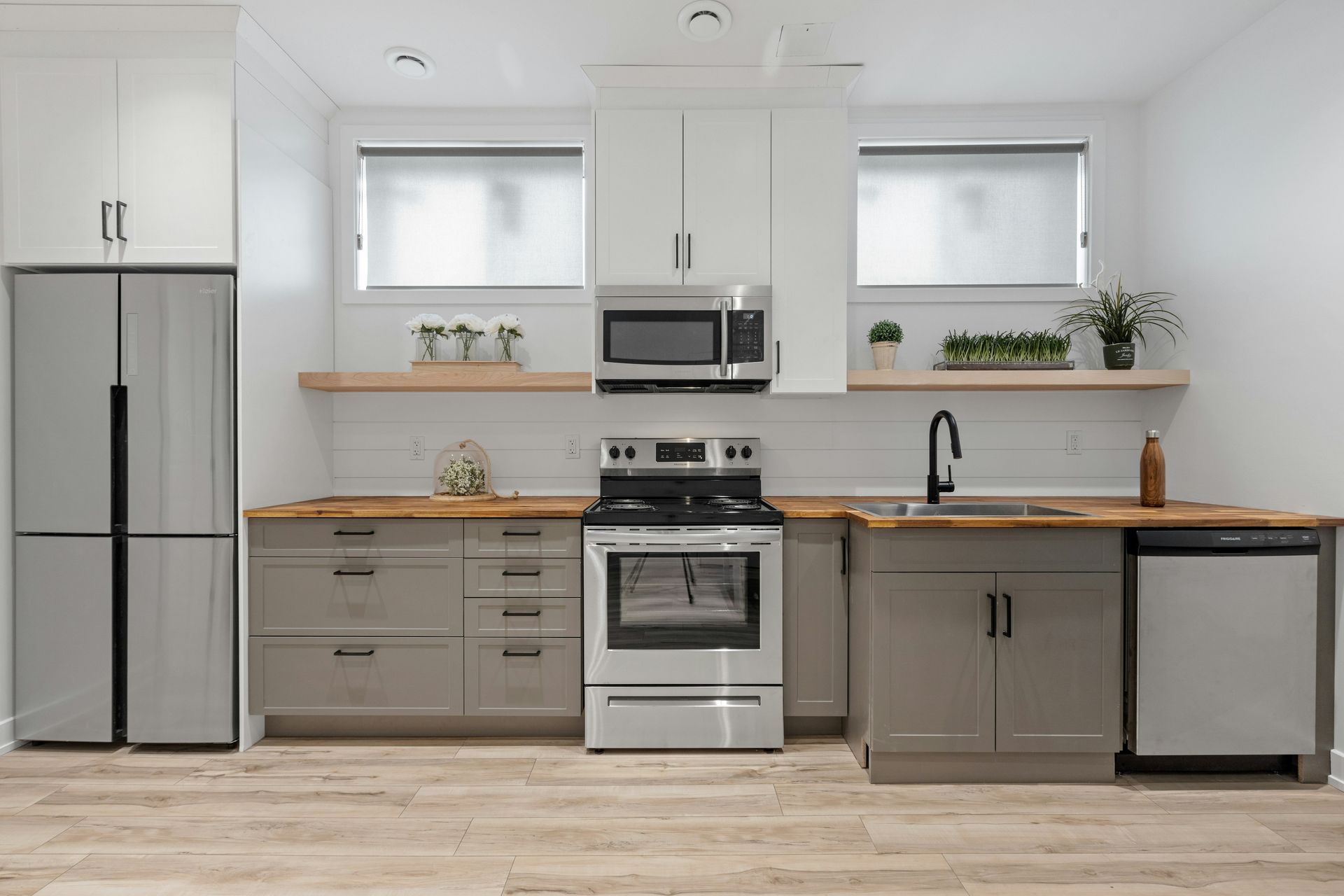 a kitchen with white cabinets